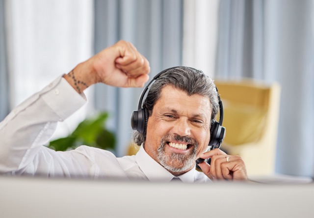 call-centre-celebrate-and-a-happy-man-at-a-comput-2023-11-27-05-01-03-utc Medium